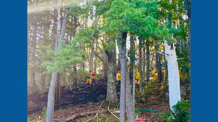Crews battle half acre woods fire in Bath